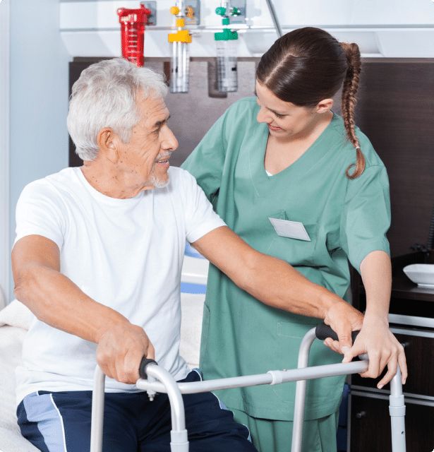 A nursing helping an elderly man