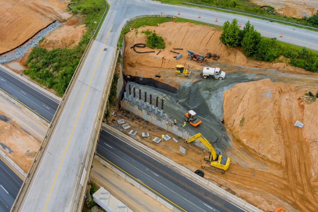 Aerial view of restoration large bridge in road construction site in the renovation of a modern road interchange in USA